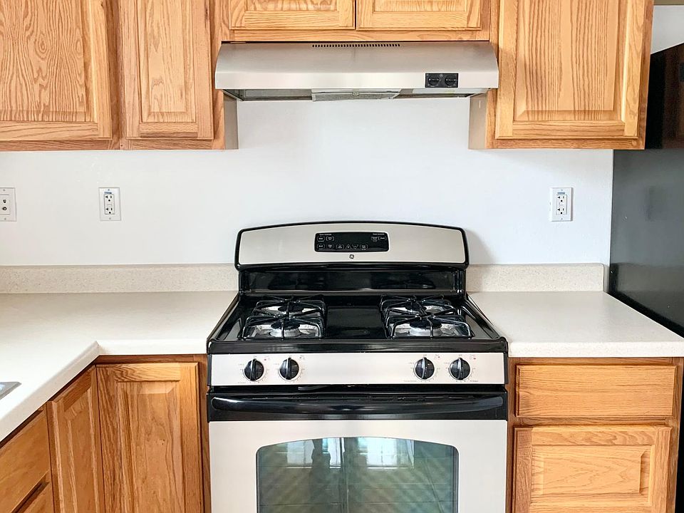 Unit #1 kitchen has plenty of cabinets and stainless steel appliances
