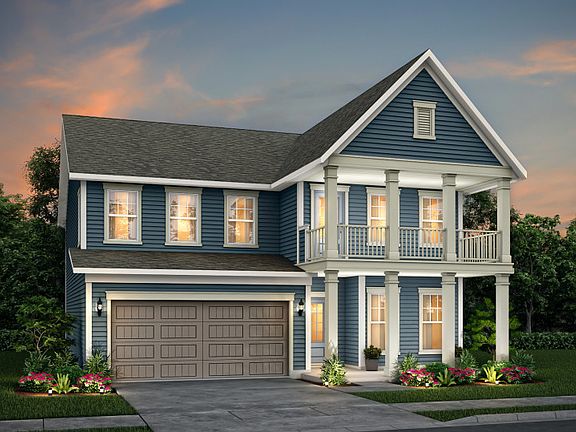 Continental exterior 26 features siding, double covered front porch deck, and 2 car garage
