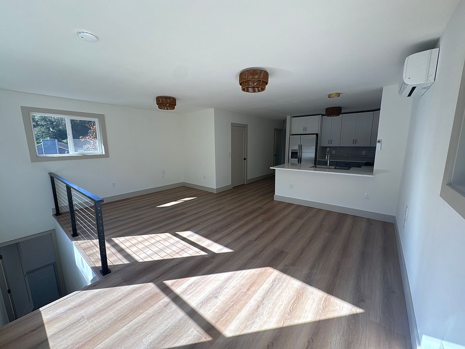 Living area and kitchen. Entrance on left of picture