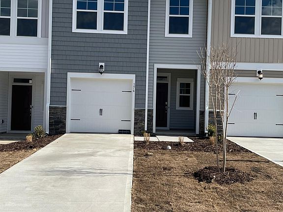 Front view - single car garage with an extra long drive way, additional parking on both sides close by