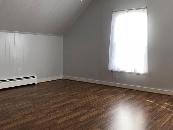 Master bedroom with ceiling fan, central heat