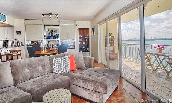 Enjoy a cozy living room setup as you overlook the bay.