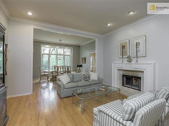 Formal living and Dining overlooks treed backyard