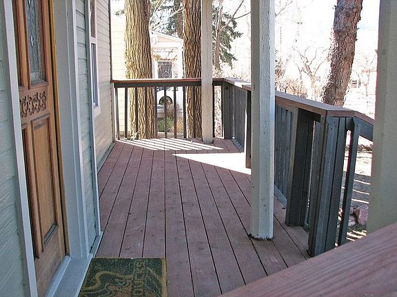 Wood deck on both front and back of the house