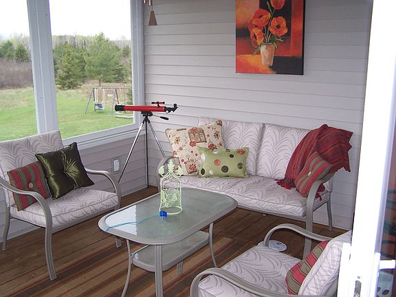 screened in porch accessible from dining room through 8 foot slider door