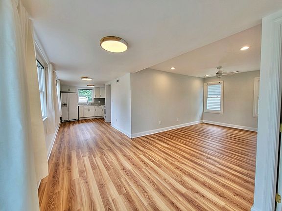 View of living room and kitchen from front door