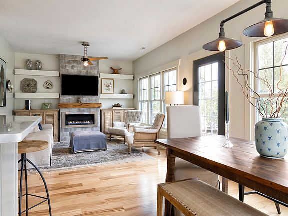 Open floor-plan with living room and dining area facing the AMAZING view. Eco-friendly ethanol