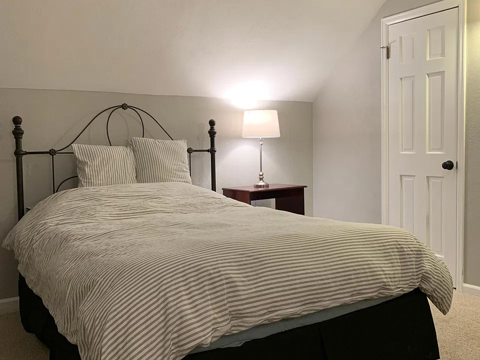 Queen bed with memory foam pad. All linens provided.