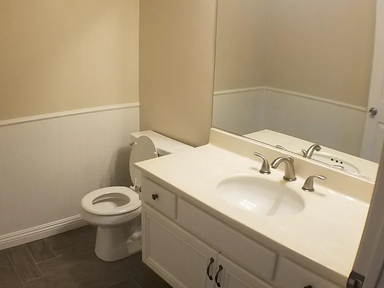 1st floor powder bath

*NOTE: This photo is not current, the bathroom has been completely updated with new vanity, quartz countertop, new sink, new faucet, new mirror, new exhaust fan, and new toilet