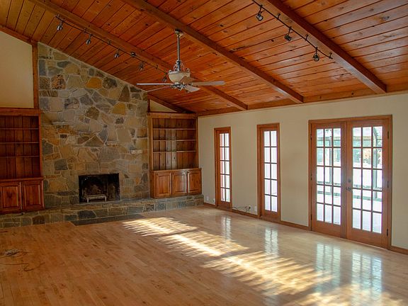 Family room with French doors leading to the sunroom.