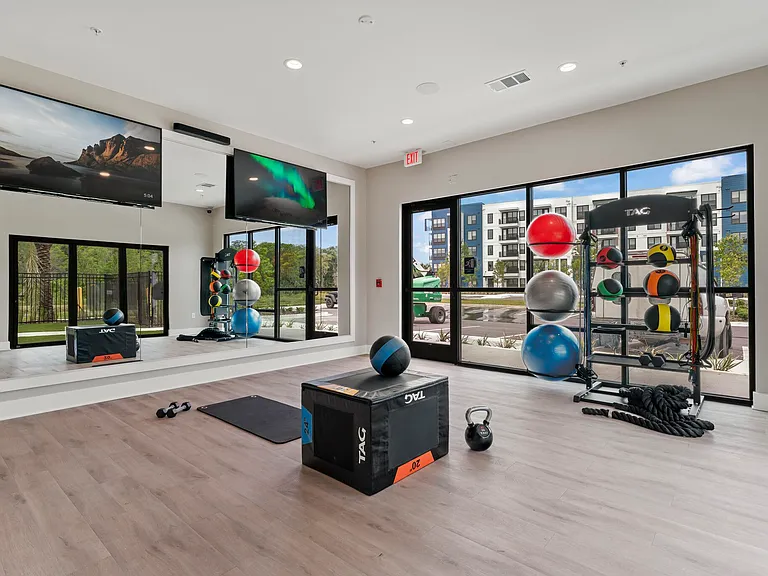 Fitness studio with luxury smart gym equipment & yoga room!