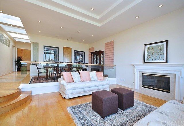 Step Down Living Room with High Ceiling & Fireplace