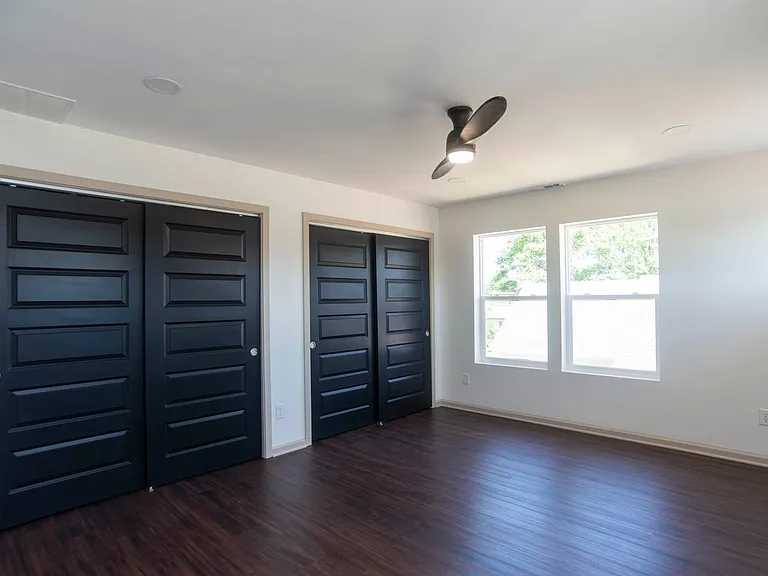 Upstairs bedroom with ensuite bathroom. City skyline view windows!