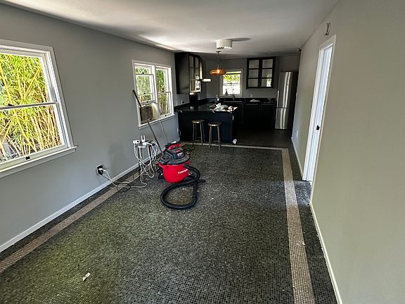 Living room with kitchen in back