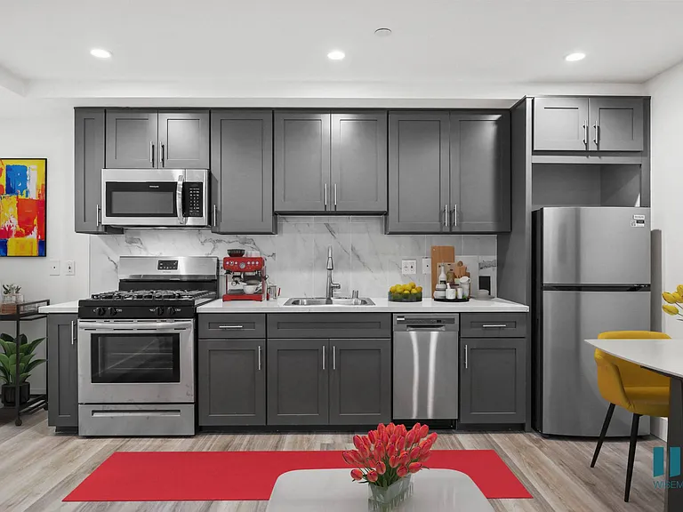 Kitchen with Stainless-Steel Refrigerator, Stove, Microwave Oven, and Dishwasher