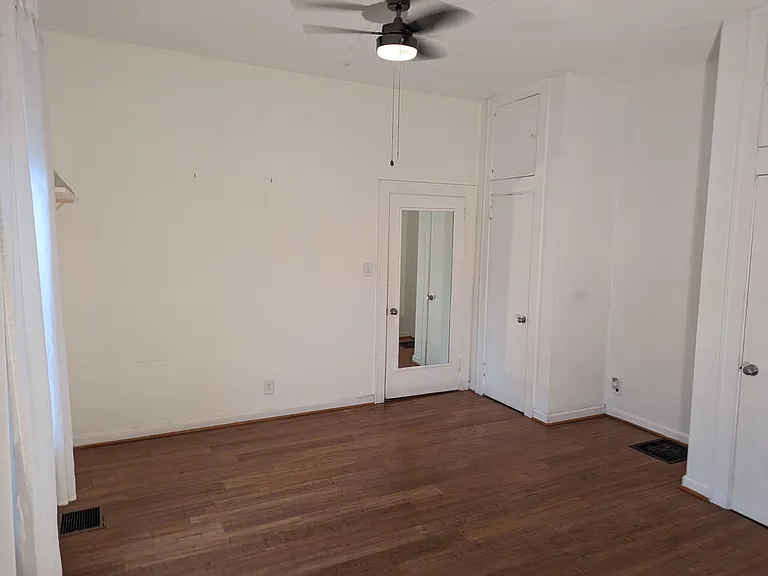 Master bedroom with 12-foot ceilings and two large, double-level closets.