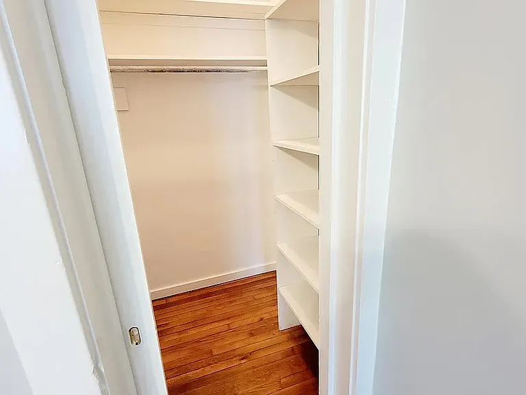 Bedroom 2 with large closet and built in shelving