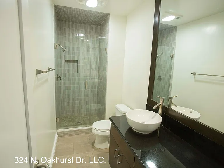 Hallway Bathroom with Walk-In Shower and Large Vanity