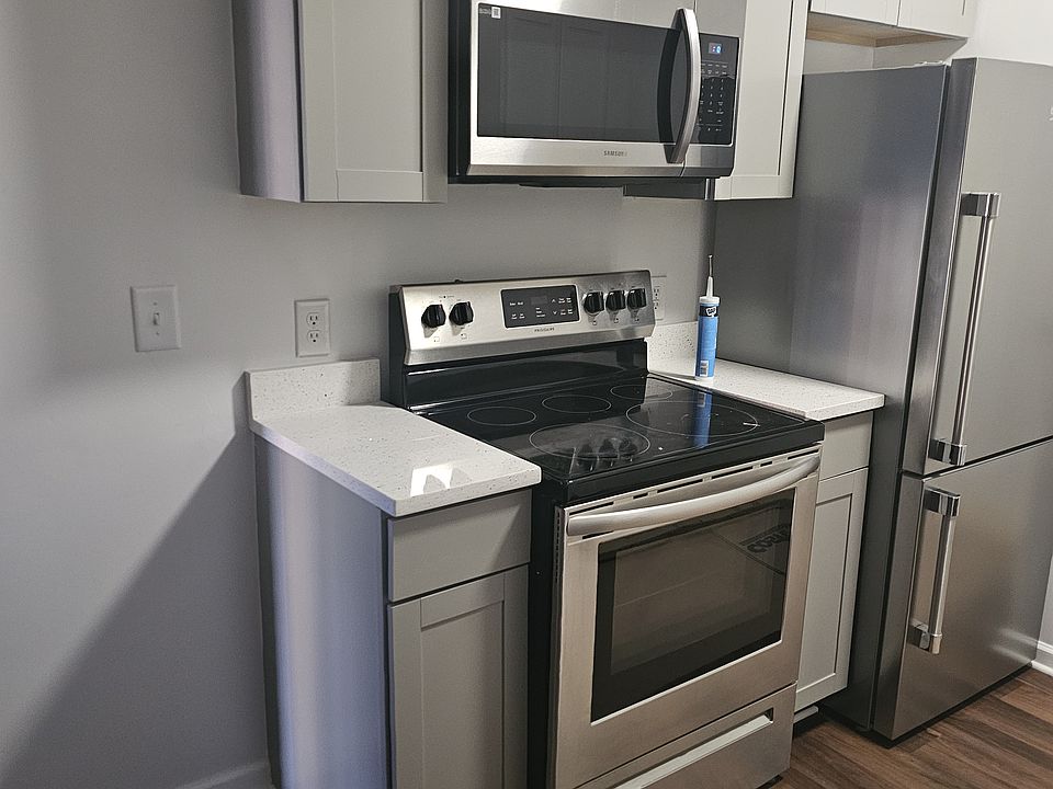 Kitchen withbstove, refrigerator and microwave