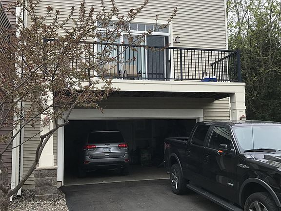 Garage entrance with 2nd floor deck