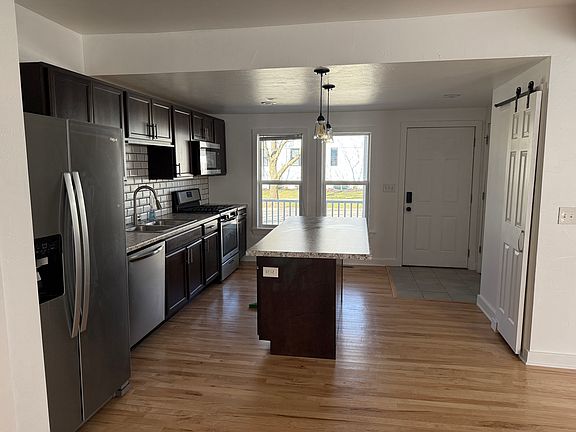 Kitchen windows overlook the front porch on Franklin Street. A perfect place to unwind and entertain!