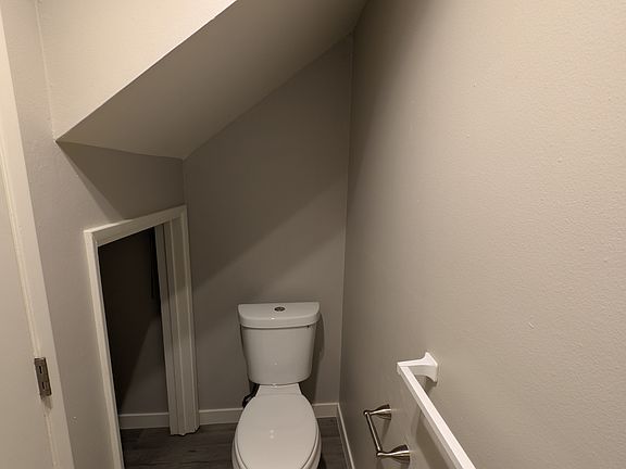 Opposite vanity in downstairs half bath, under stair storage. Ready for those out of the way items.