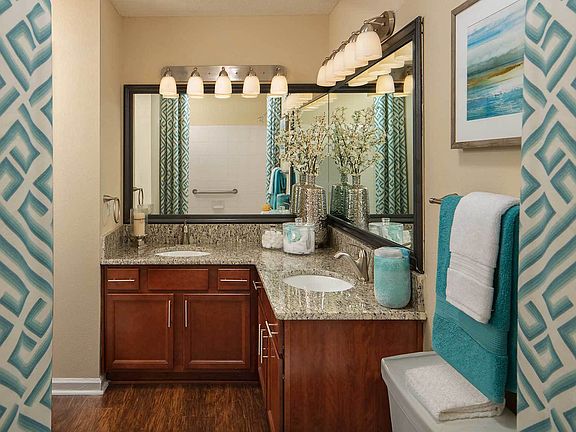 Bathroom with wood style flooring and granite countertops