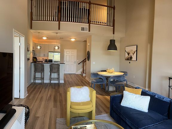 Living room with overlooking loft balcony