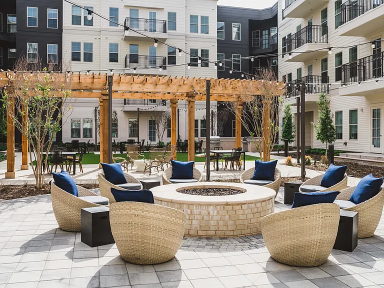 Outdoor fire put area with circular lounge seating