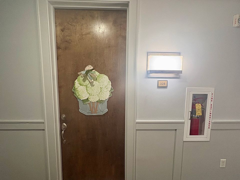 Front door in enclosed hallway with A/C and heat