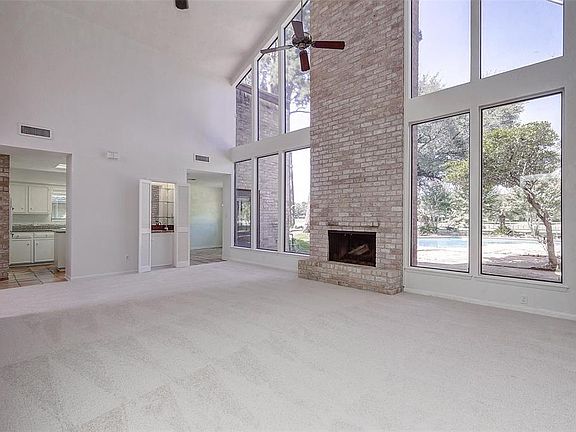 Floor to ceiling windows showing breathtaking views of the 2nd hole of the Jack Rabbit course of Champions Golf Club.