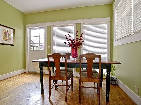 Breakfast Nook with large windows and door to lovely backyard.
