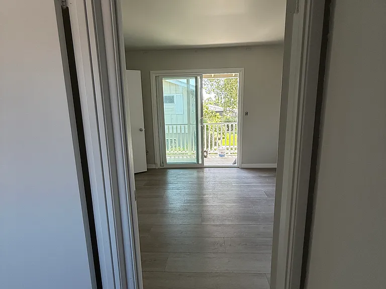 Bedroom one, with balcony access.
