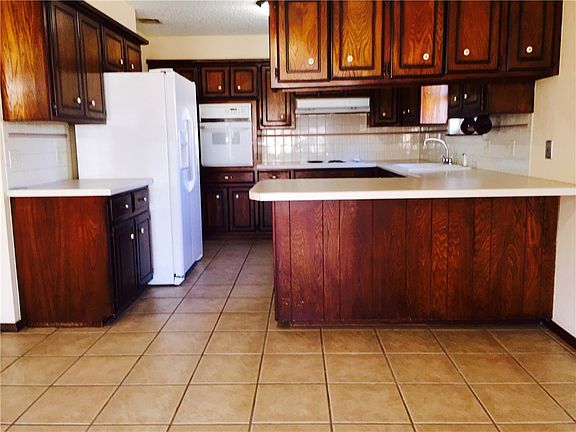 Large and work-friendly kitchen.  Plenty of room for a cook, or two, or three! Breakfast bar, updated appliances and a large dining area.