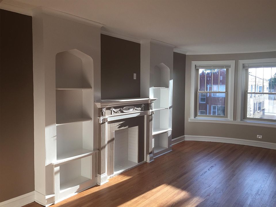 Book Shelves on each side of fireplace