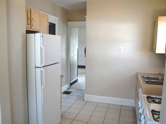 The Kitchen Includes All Appliances: Gas Stove, Refrigerator, Microwave/Hood, 