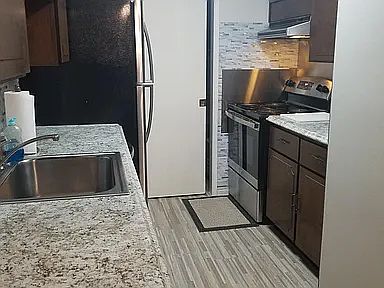 Kitchen leading to utility room
