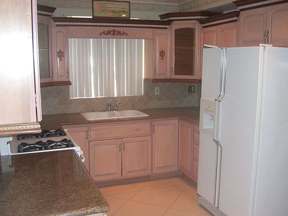 Upgraded kitchen with granite counter tops.