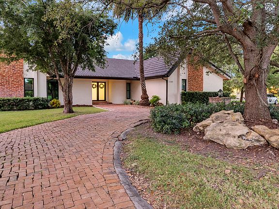 Front entrance of the home, featuring impact doors and a large, welcoming entryway.