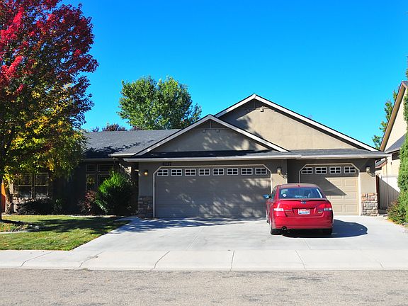 Outside. Mature landscaping. 3 car garage.