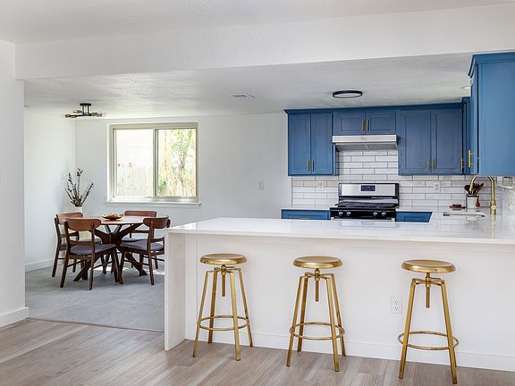 Breakfast bar, kitchen and formal additional dining area as viewed from formal dining room.