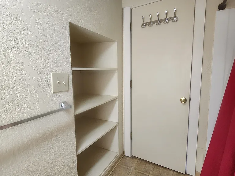 Upstairs bath view 2 with large shelving area
