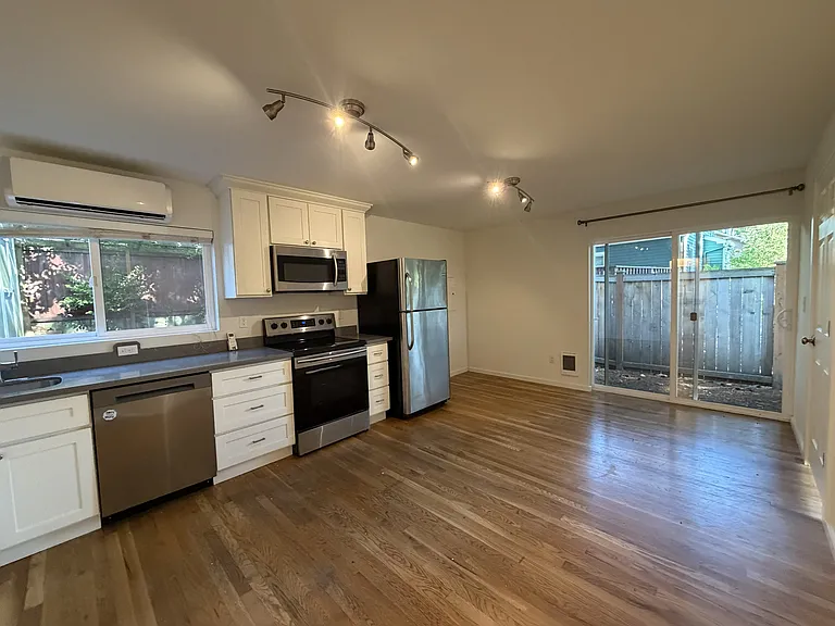 Kitchen with sliding glass doors. hard wood floors throughout