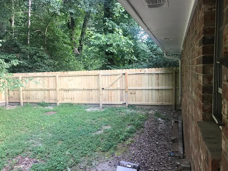 Fenced in back yard for security and privacy
 Great for a bar b que or relaxing as well as secure place for the kids to play
 Nice creek just outside of your backyard complete with fish!!