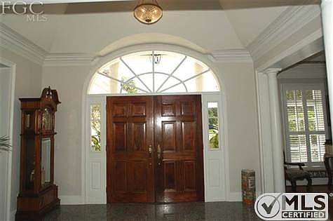 Foyer and gorgeous front door with Palladium Transom window.