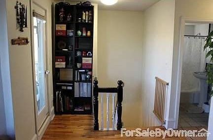 Front Entry : Front door on second floor, steps up to third floor living space.