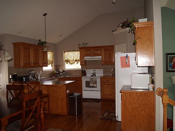 Hardwood floors in spacious kitchen.