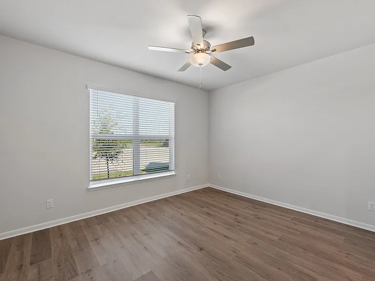 The master bedroom has a large window that lets in great, natural light.