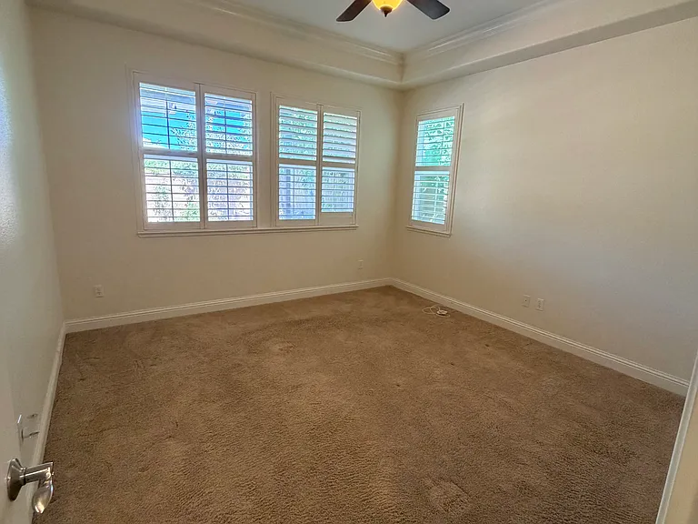 Main bedroom with views into the backyard