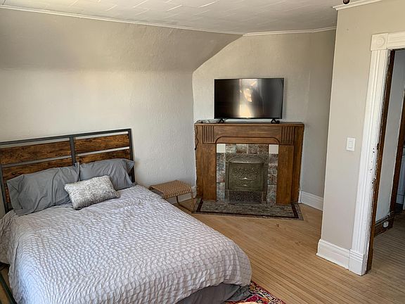 1st bedroom on the 2nd floor w/fireplace, TV, and 2 windows that have views of Lake Superior